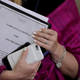 A White House employee holds a copy of the ‘Narrative Schedule For The President’ before President Donald Trump announces his decision to pull out of the Paris climate agreement at the White House June 1, 2017 in Washington, DC.